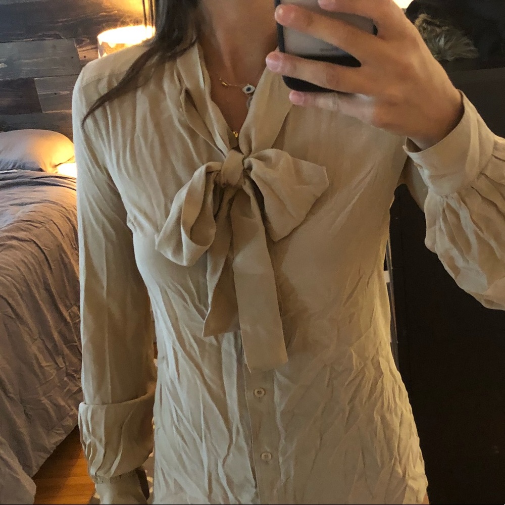 Tan Gucci blouse with bow tie detail